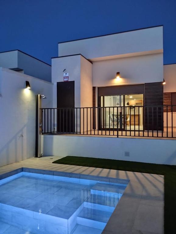 a villa with a swimming pool at night at Casa de Goya in Argés