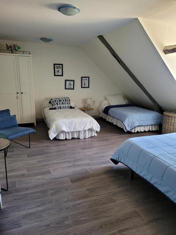 Postel nebo postele na pokoji v ubytování Manoir De Keringant
