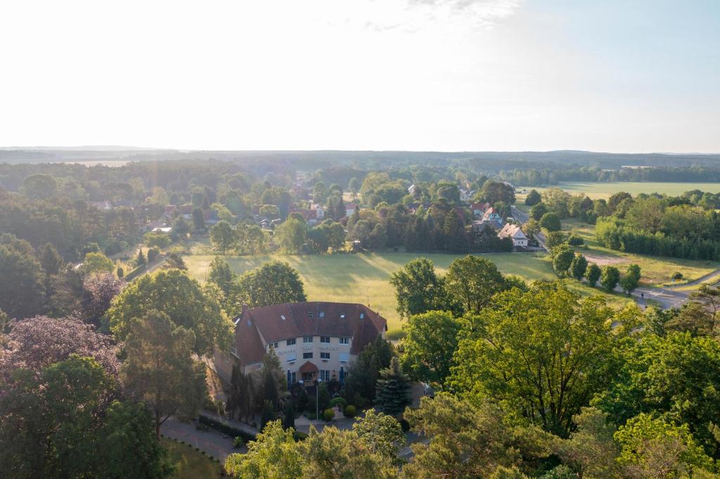 an aerial view of a house in the trees at Hotel Am Wald B&B in Michendorf