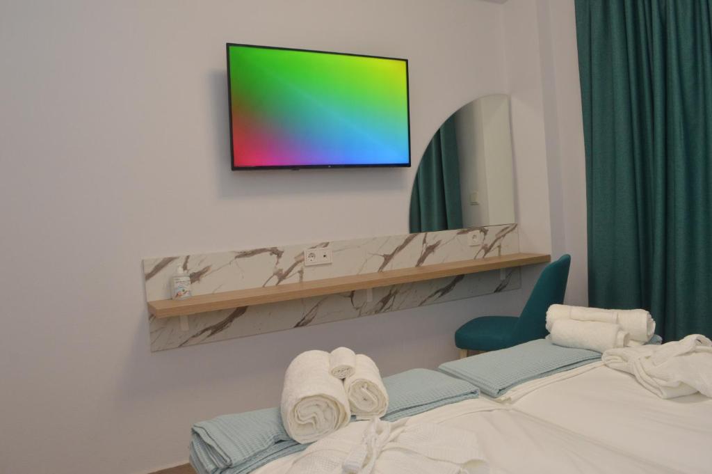 Postel nebo postele na pokoji v ubytování Electra Suites