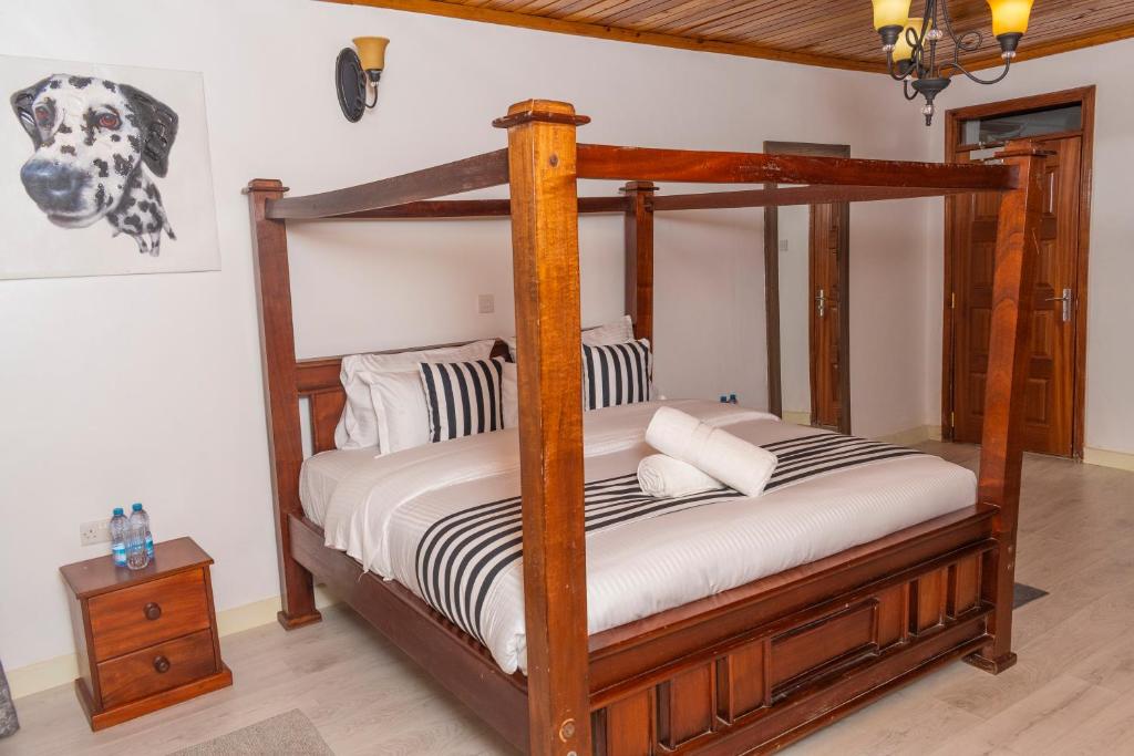 Postel nebo postele na pokoji v ubytování Elevate by African Manor