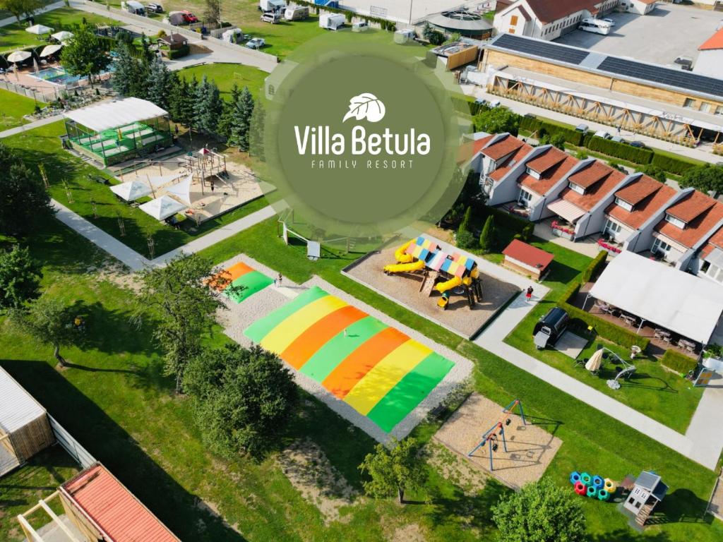 an aerial view of a park with a building at Villa Betula Resort & Camping in Liptovská Sielnica