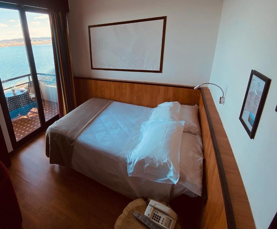 Postel nebo postele na pokoji v ubytování Hotel Concorde