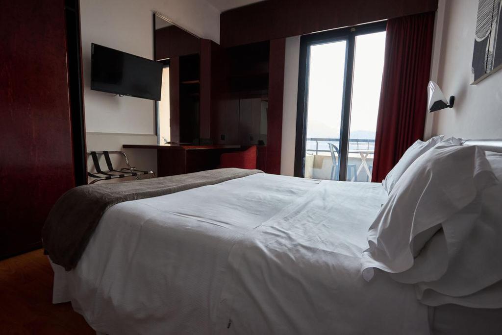 Postel nebo postele na pokoji v ubytování Hotel Concorde