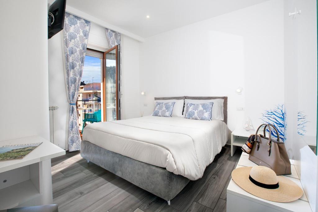 Postel nebo postele na pokoji v ubytování YourHome - Maison degli Aranci