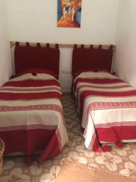 Postel nebo postele na pokoji v ubytování Riad Gloria