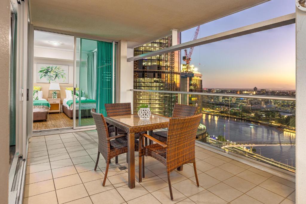 a dining room with a view of a city at Luxury Oasis with Indulgent River Views in Brisbane