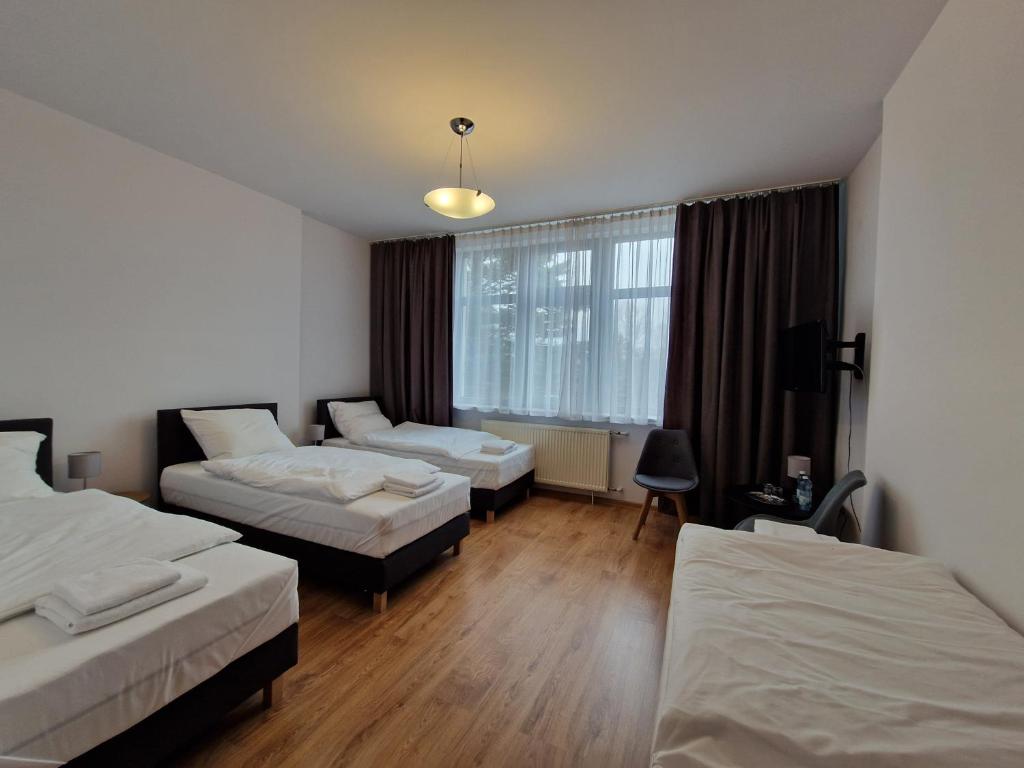 Postel nebo postele na pokoji v ubytování Hotel Tor Kielce