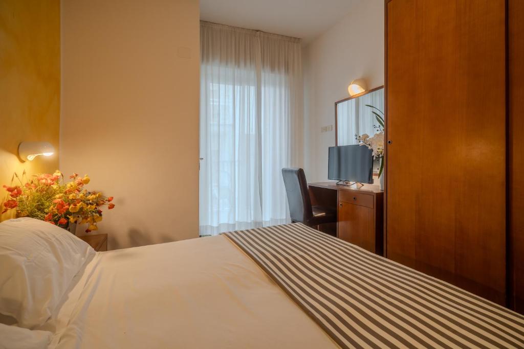 Postel nebo postele na pokoji v ubytování Hotel Mia