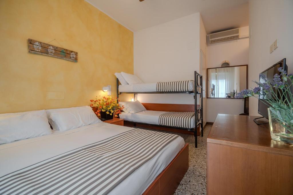 Postel nebo postele na pokoji v ubytování Hotel Mia