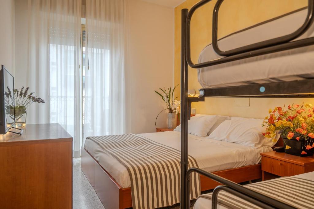 Postel nebo postele na pokoji v ubytování Hotel Mia