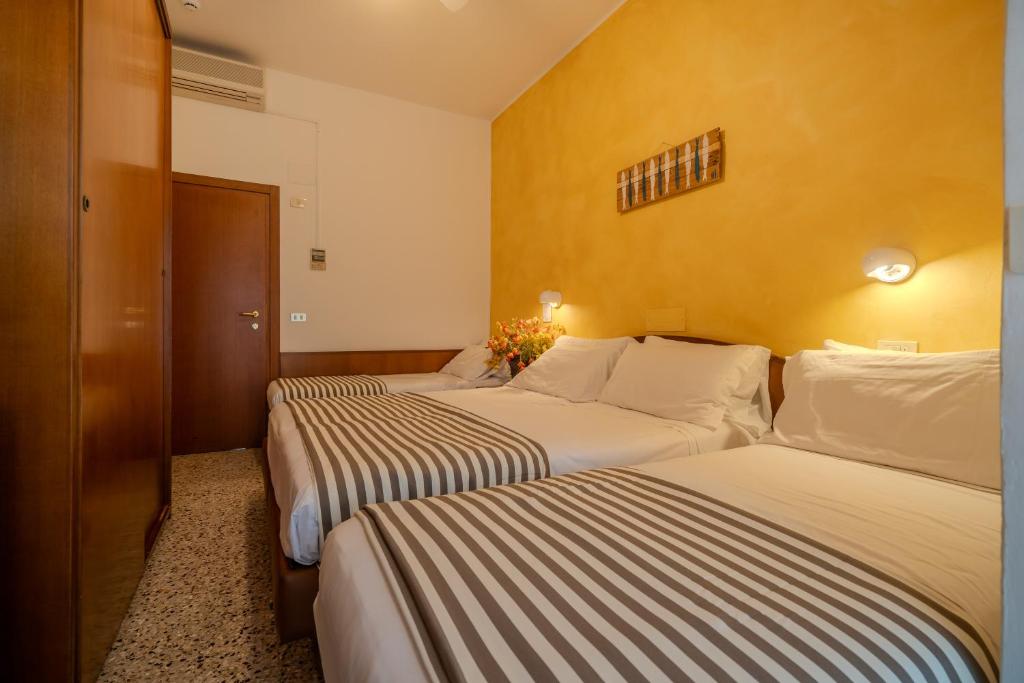 Postel nebo postele na pokoji v ubytování Hotel Mia