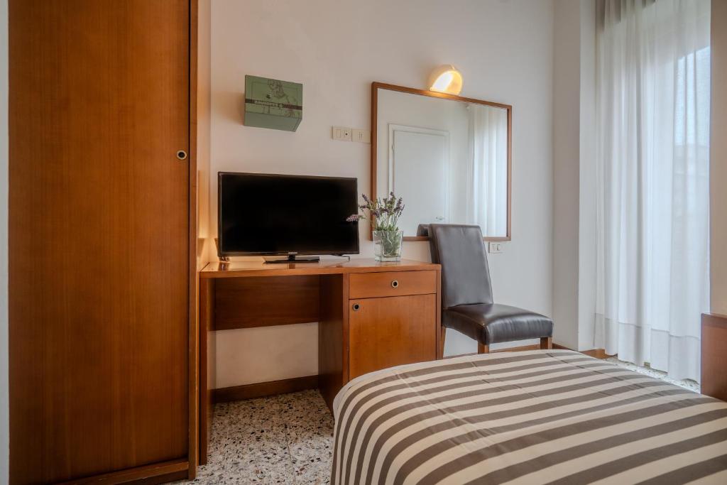 Postel nebo postele na pokoji v ubytování Hotel Mia