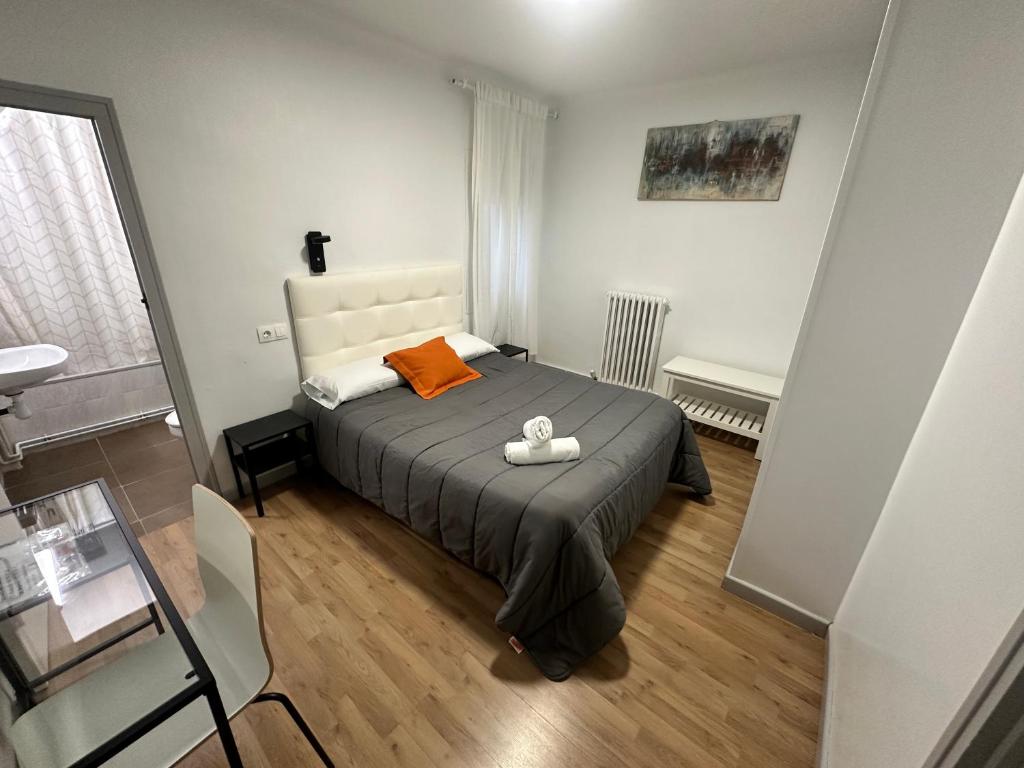 Posteľ alebo postele v izbe v ubytovaní Hostal ARS