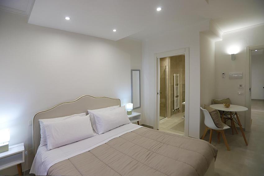 Postel nebo postele na pokoji v ubytování Dorant Charme&Rooms
