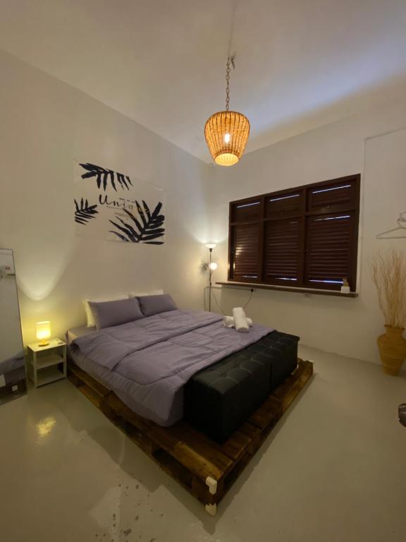 a bedroom with a large bed in a room at Two Sip Home in George Town