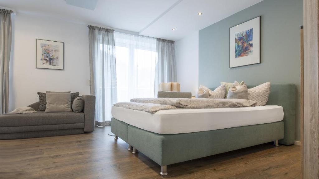 Postel nebo postele na pokoji v ubytování Erfblick-Apartments