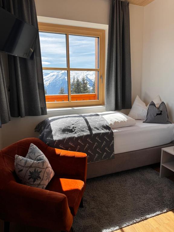 Postel nebo postele na pokoji v ubytování GLOCKNERALM - Exklusiv erreichbar mit Skilift