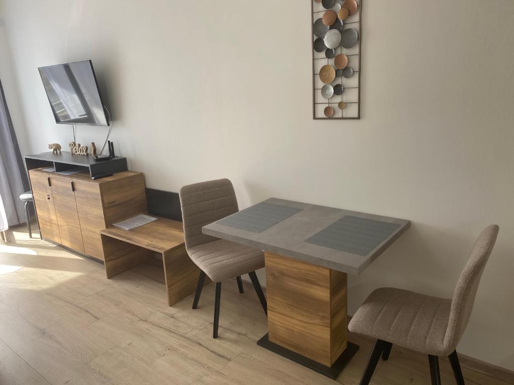 Televiisor ja/või meelelahutuskeskus majutusasutuses D&D Wellness Apartmanok - Dávid Wellness Apartman
