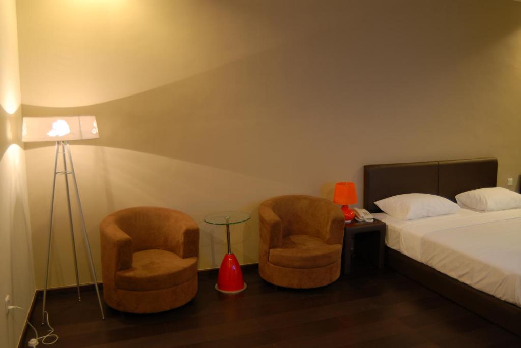 Postel nebo postele na pokoji v ubytování Manja Hotel