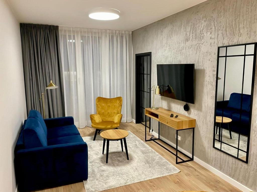 TV a/nebo společenská místnost v ubytování Apartos Seaside Luxury Apartments