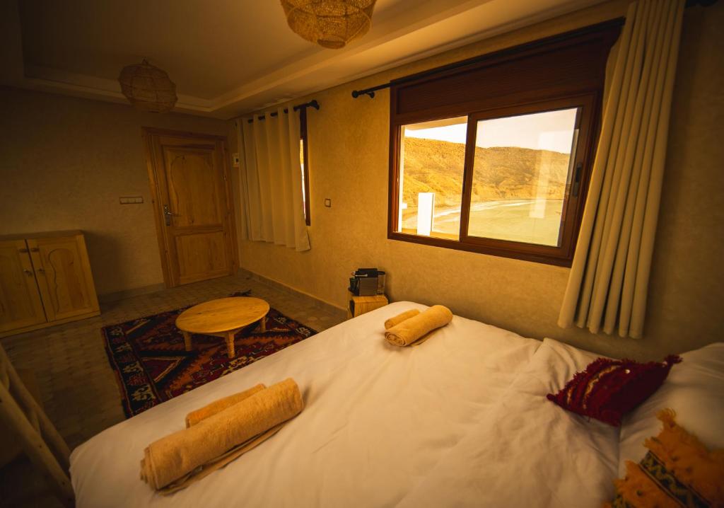 Postel nebo postele na pokoji v ubytování The Moroccan Surf House