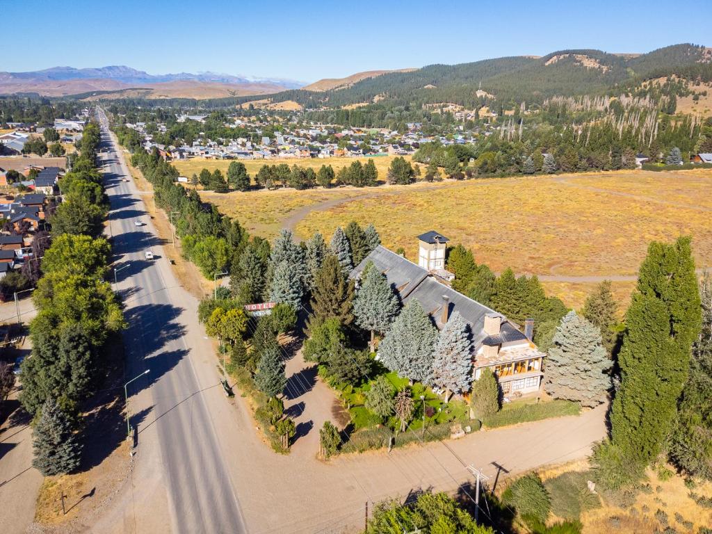 an aerial view of a house with trees at Alejandro in Junín de los Andes