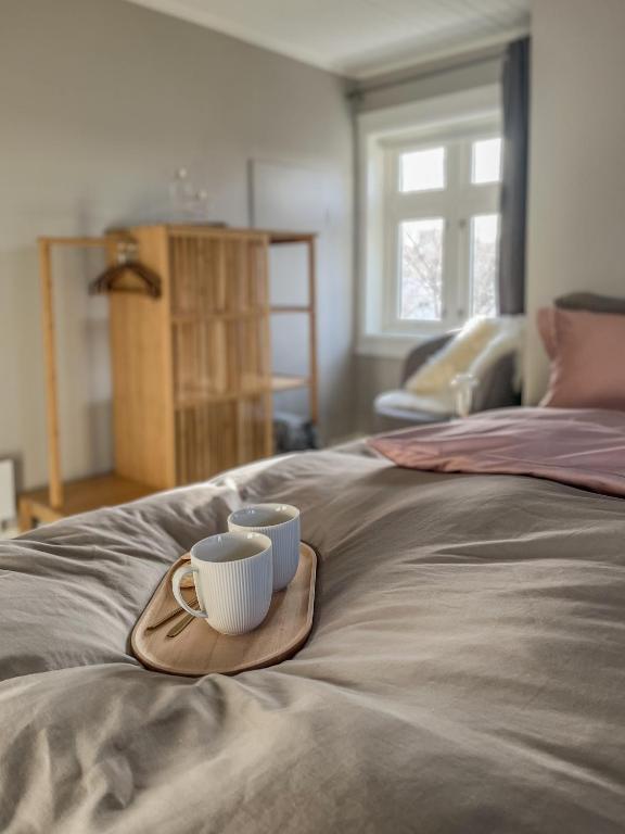 Кровать или кровати в номере Husly Reine - your home with Reinebringen view