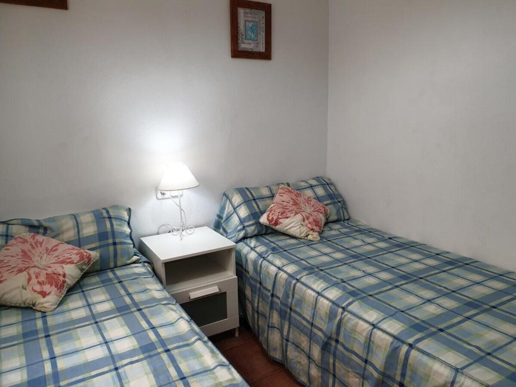 Postel nebo postele na pokoji v ubytování F76. Vistas al mar en Fornells!