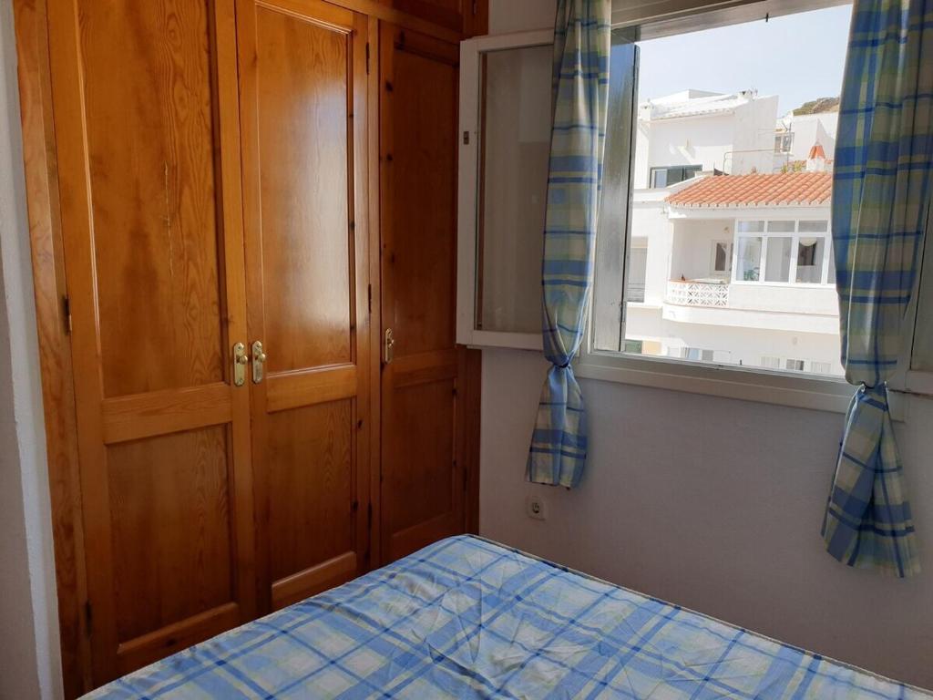 Postel nebo postele na pokoji v ubytování F76. Vistas al mar en Fornells!