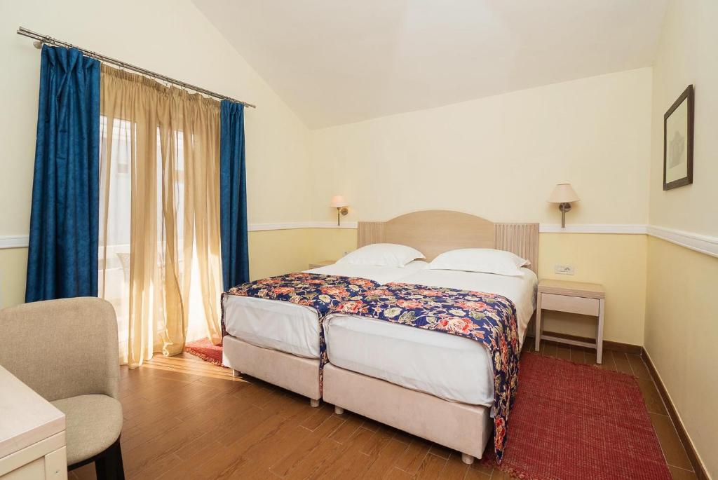 Posteľ alebo postele v izbe v ubytovaní Amadria Park Apartments Šibenik