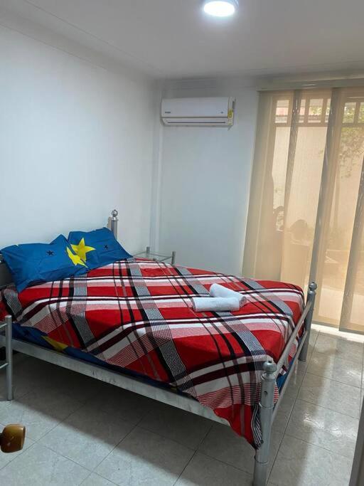 Postel nebo postele na pokoji v ubytování apartment in neiva goliat 101