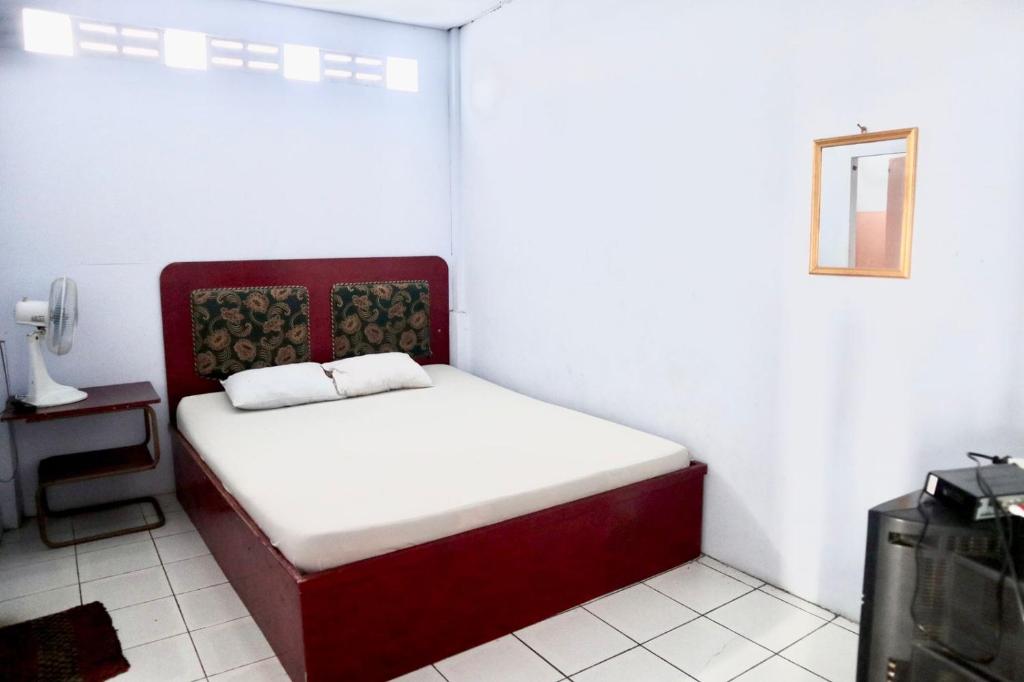 Ένα ή περισσότερα κρεβάτια σε δωμάτιο στο Hotel Kalingga 2