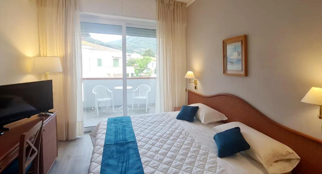 Postel nebo postele na pokoji v ubytování Hotel Levante - Isola d'Elba
