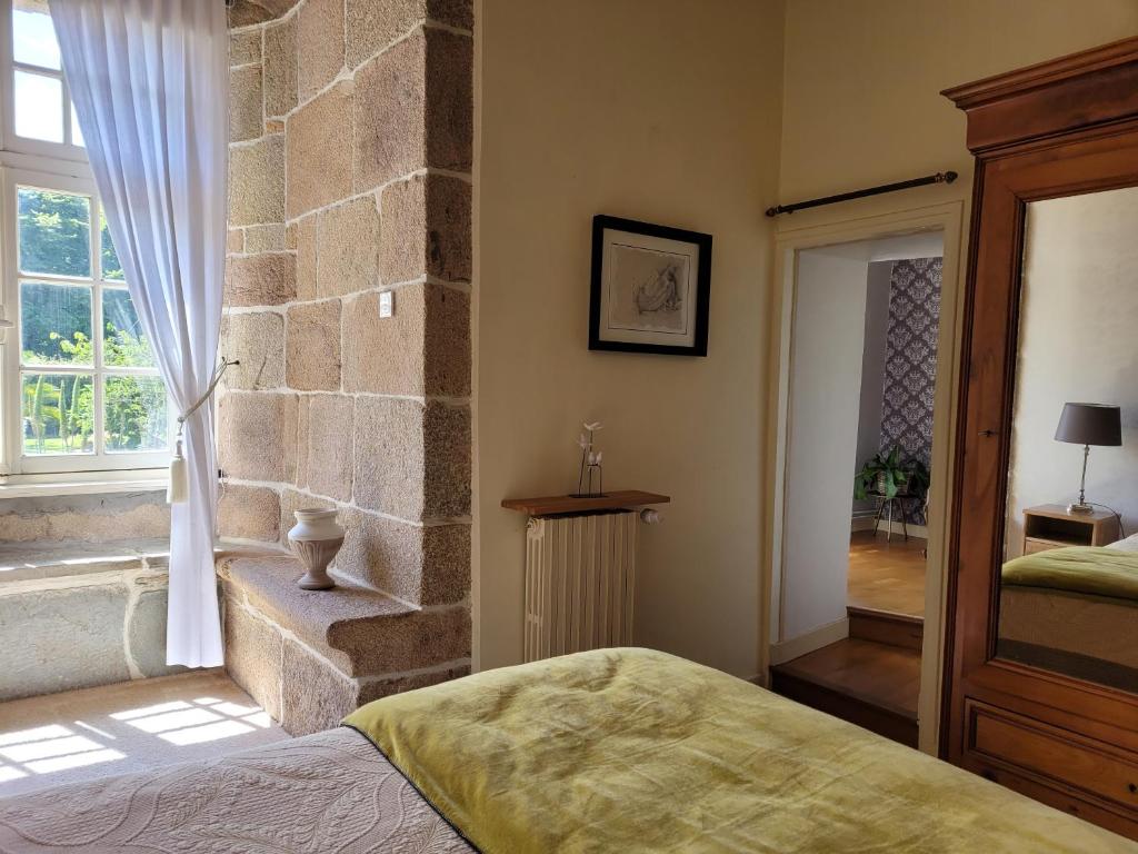 Postel nebo postele na pokoji v ubytování Manoir De Keringant