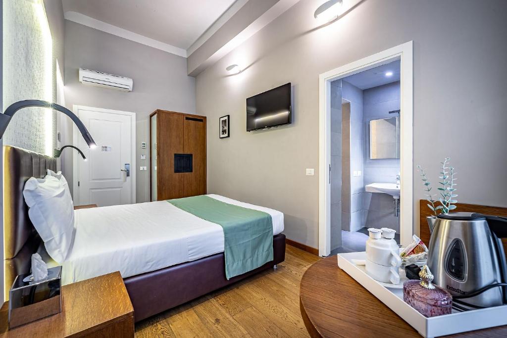 Posteľ alebo postele v izbe v ubytovaní Antico Centro Suite