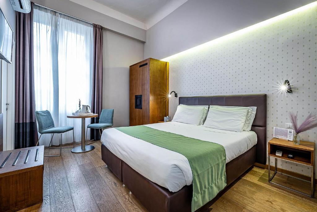 Posteľ alebo postele v izbe v ubytovaní Antico Centro Suite
