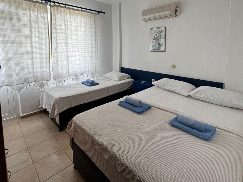 Postel nebo postele na pokoji v ubytování Mesken otel