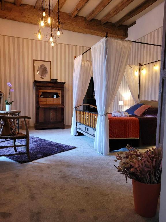 Postel nebo postele na pokoji v ubytování Manoir De Keringant