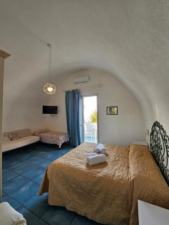 Posteľ alebo postele v izbe v ubytovaní Residence Limoneto Ischia