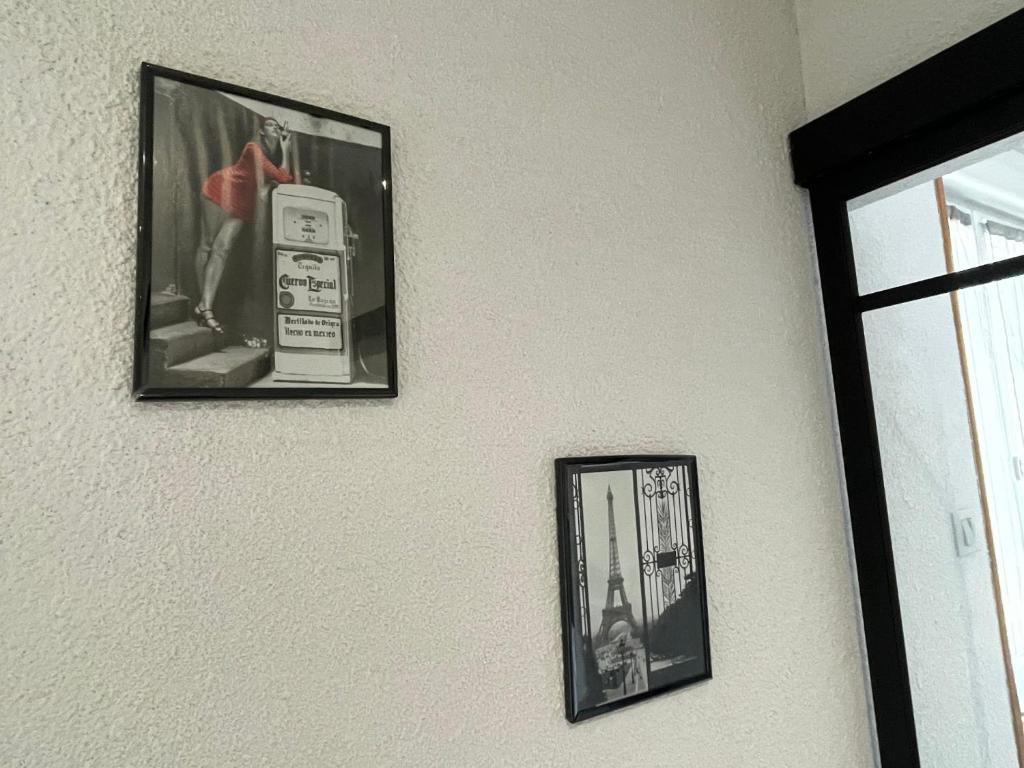 two pictures of a pay phone on a wall at APPARTEMENT HYPER CENTRE numéro 101 in Roanne