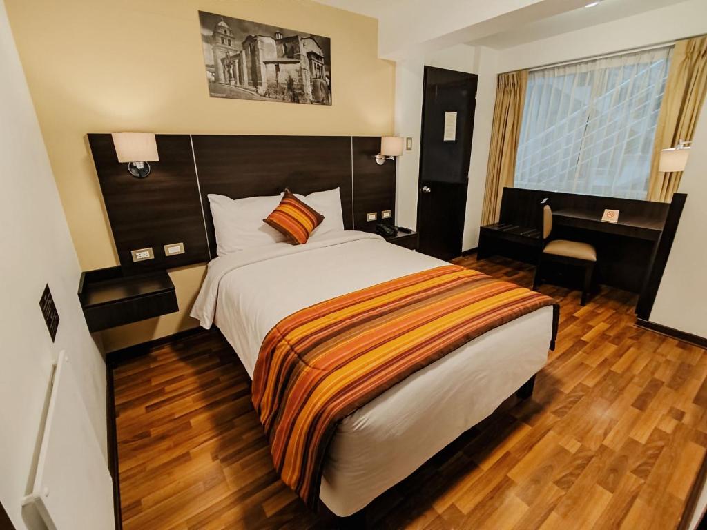 Postel nebo postele na pokoji v ubytování Royal Inn Cusco Hotel