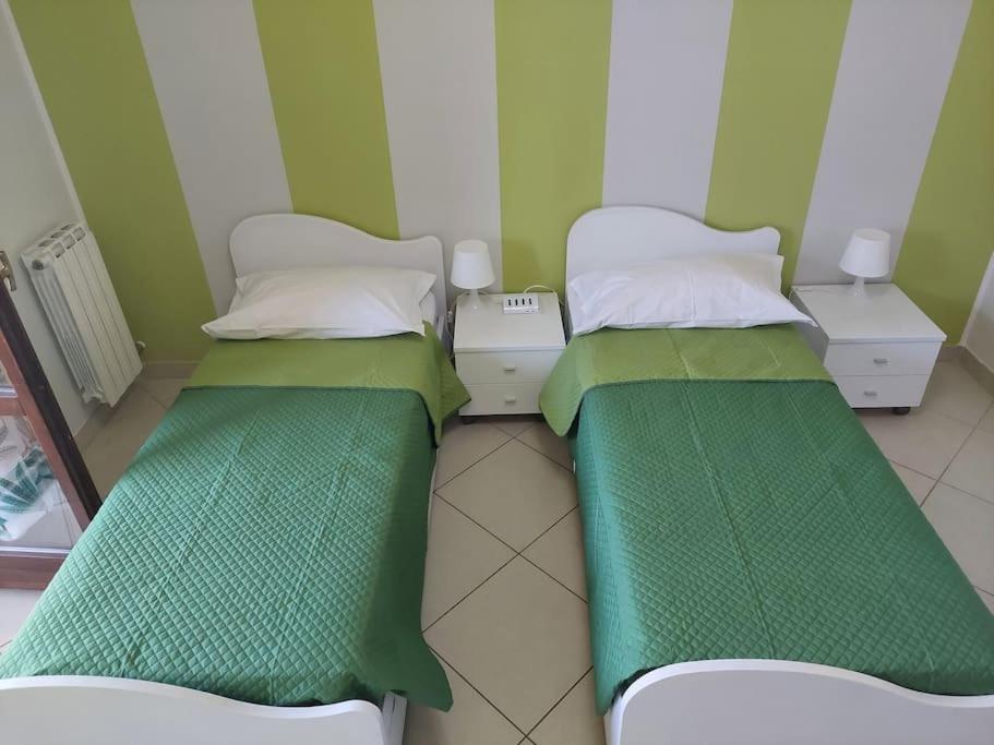 Postel nebo postele na pokoji v ubytování Gru House Family