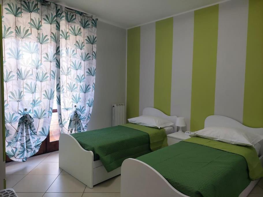 Postel nebo postele na pokoji v ubytování Gru House Family
