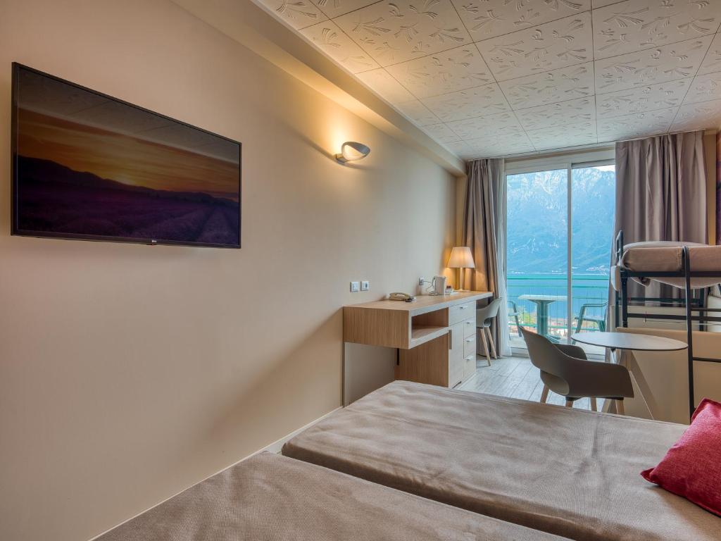 Postel nebo postele na pokoji v ubytování Hotel Cristina