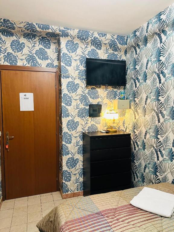 Posteľ alebo postele v izbe v ubytovaní Magenta Roma house