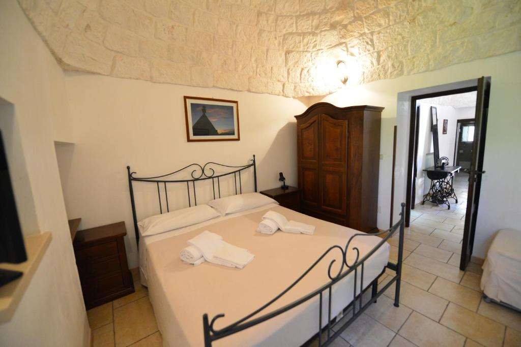 Łóżko lub łóżka w pokoju w obiekcie B&B Masseria Piccola