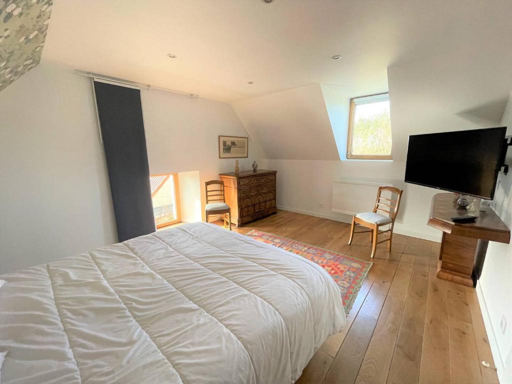 Katil atau katil-katil dalam bilik di Maison bretonne en pierre avec WIFI et piscine couverte &agrave; LOUANNEC - R&eacute;f 846