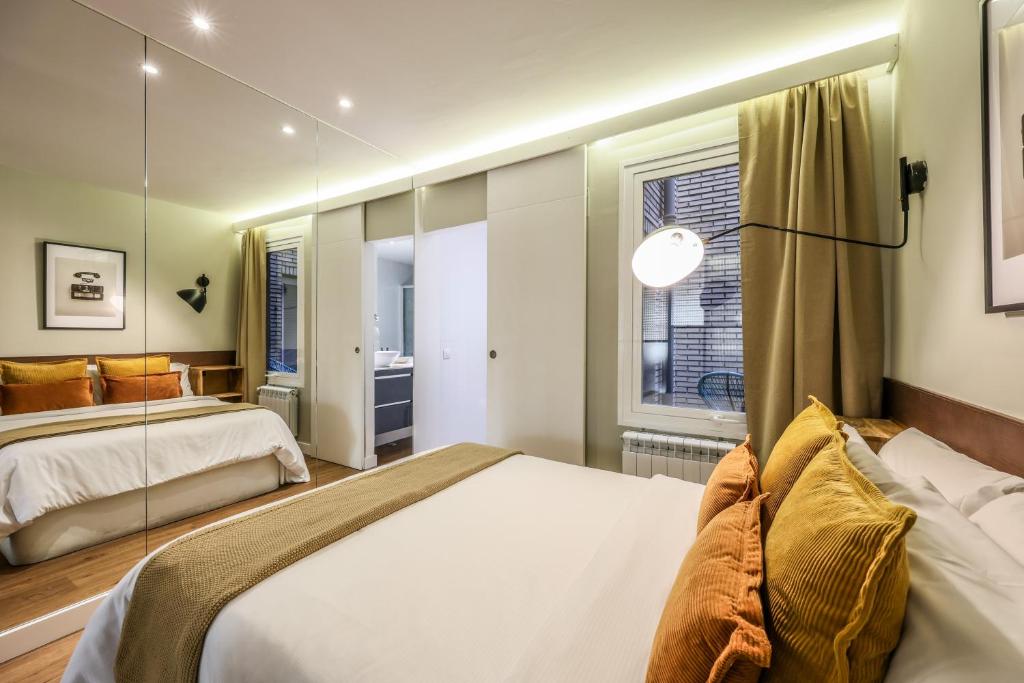 A bed or beds in a room at AP Chueca
