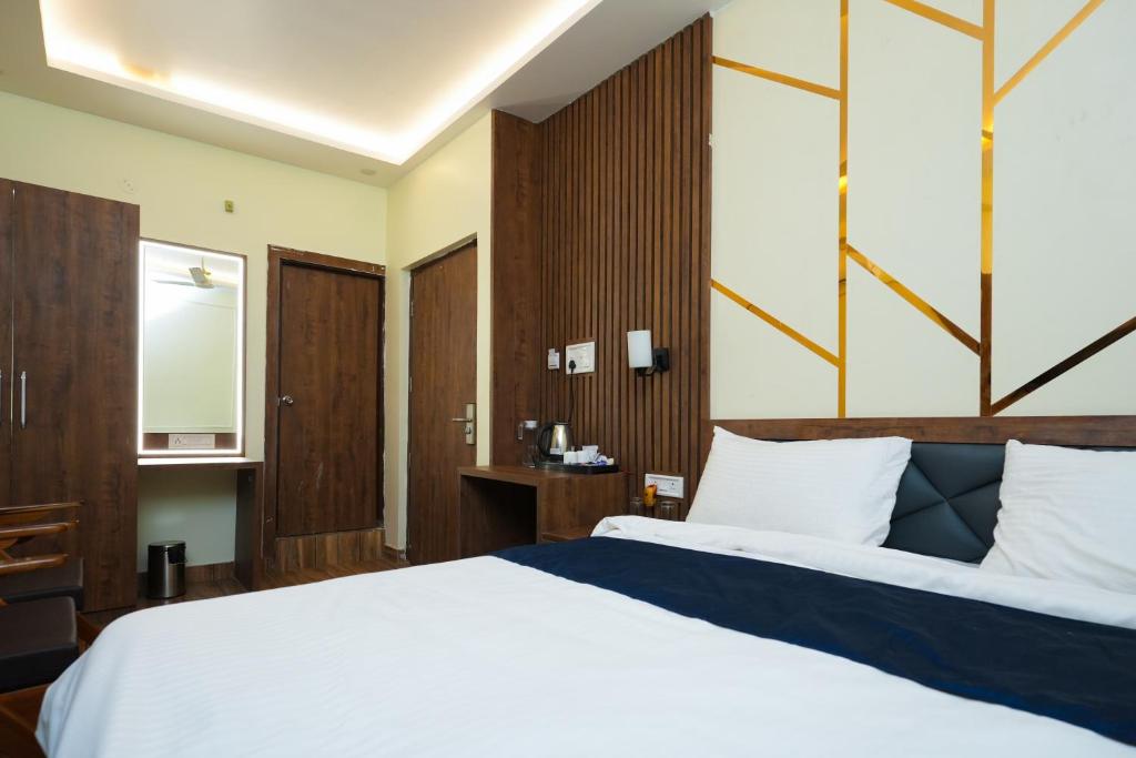 Posteľ alebo postele v izbe v ubytovaní Hotel Pavitra